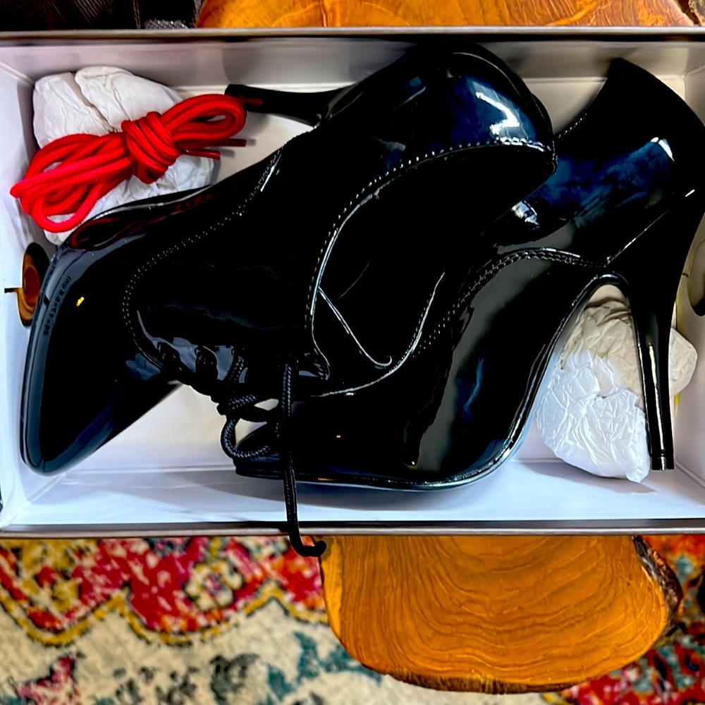 Never worn Oxford shoes comes with original box and red shoe laces.